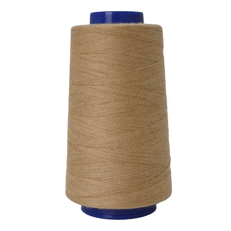 A spool of heavy-duty waterproof bonded polyester thread in tan with a blue core.