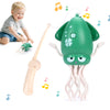 A toddler is interacting with an interactive dancing squid toy that features lights and music.