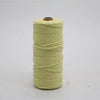 A spool of light yellow cotton macrame cord, 3mm/4mm thickness, used for crafting.