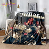 A dark graphic throw blanket featuring portraits of Eminem and Tupac in a vintage style.