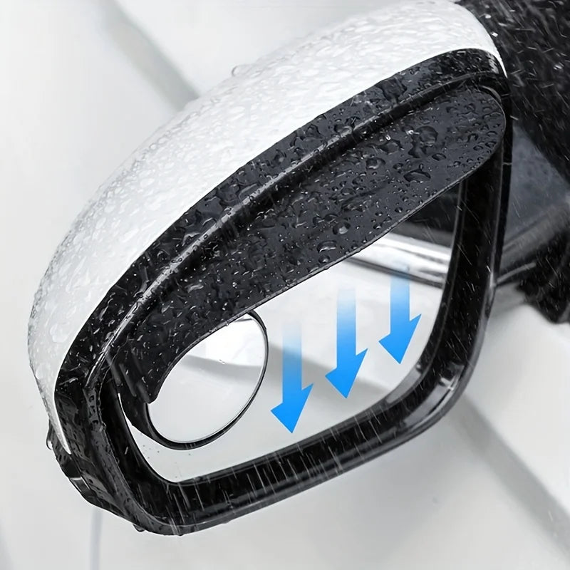 Close-up view of a black car blind spot mirror with a clear lens and white rain shield, showing blue arrows indicating the vi