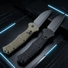 A folding pocket knife with a gray blade and a light tan anti-slip handle resting on a dark surface.