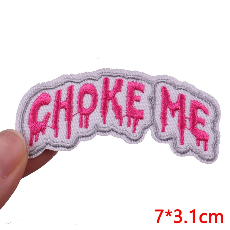 Pink embroidered iron-on patch set spelling out CHOKE ME