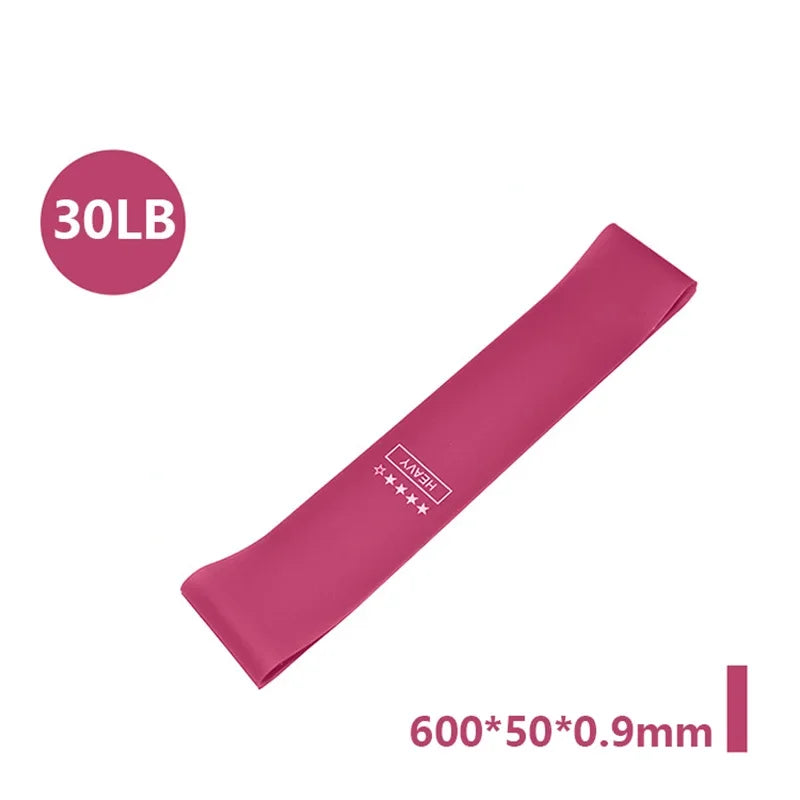 A pink resistance band labeled 30LB, measuring 600x50x0.9mm.