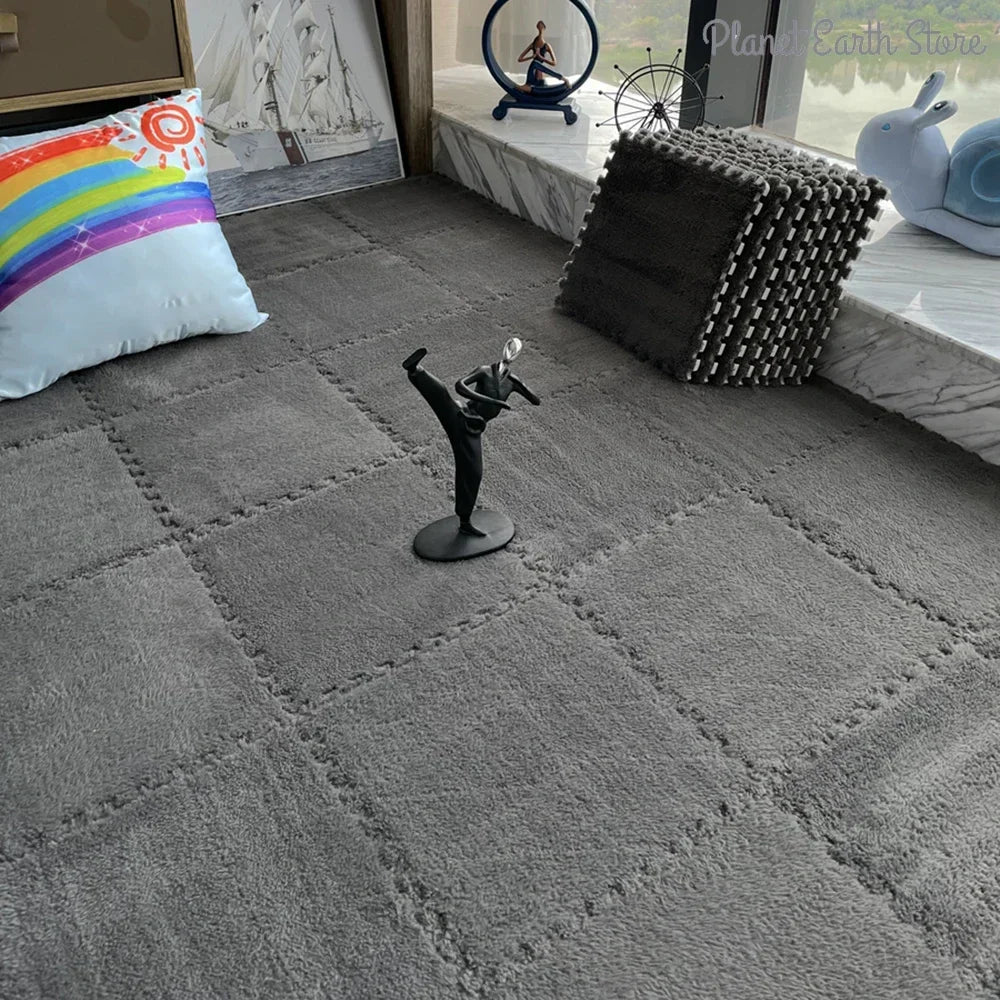 A gray carpet features a black figurine of a dancer and a light blue plush toy near a window display.