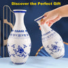 A hand is holding a white ceramic vase with blue floral patterns, demonstrating the 3D puzzle design.