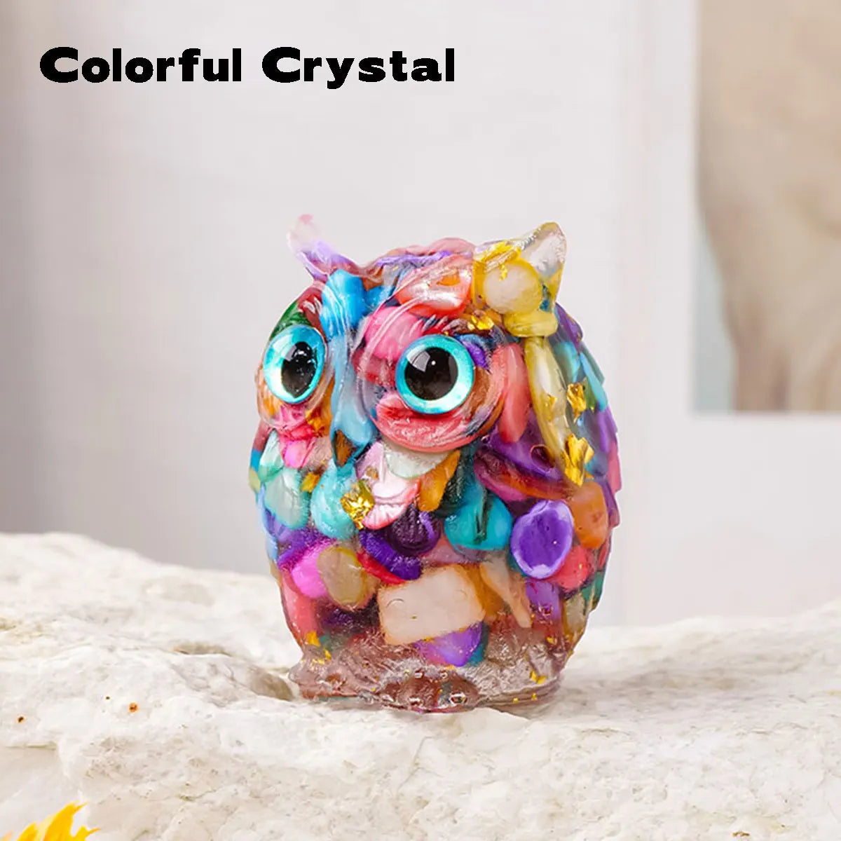 Colorful crystal owl figurine made of resin with a natural crushed stone finish