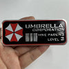 A close-up of an aluminum alloy honeycomb metal sticker with the text Umbrella Corporation and Hive Parking Level 3 printed o