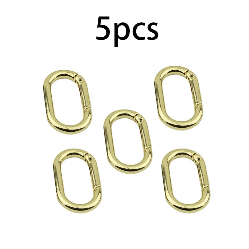Fünf goldene ovale O-Ring-Schnallen aus Feder für Taschen und Gürtel