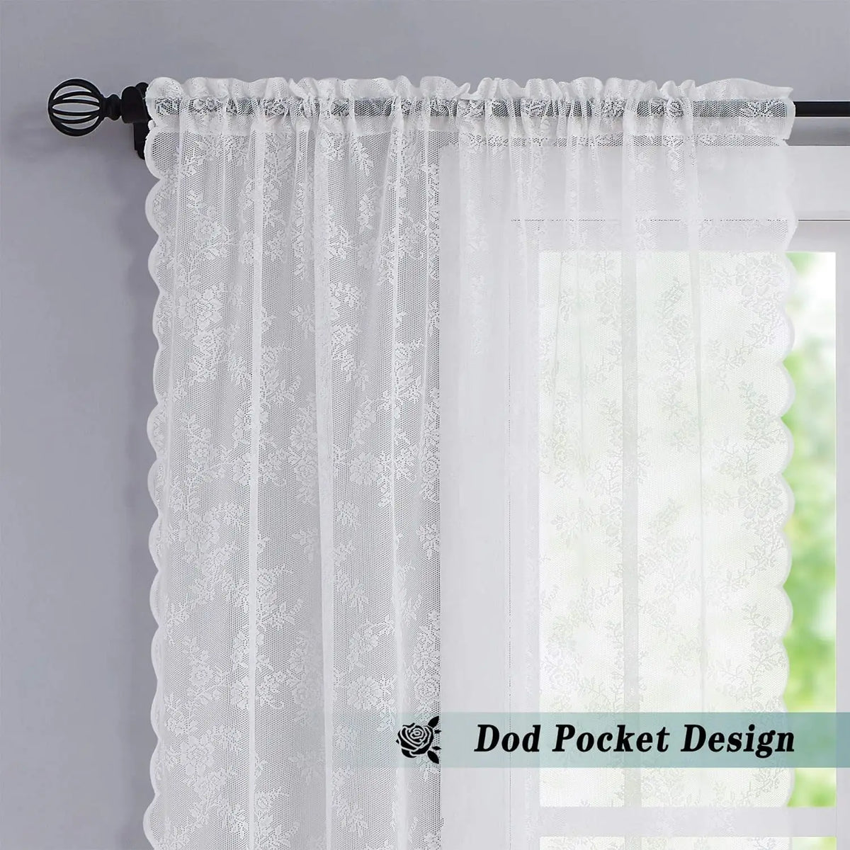 White vintage floral lace curtain panel with a dog pocket design hanging on a rod.