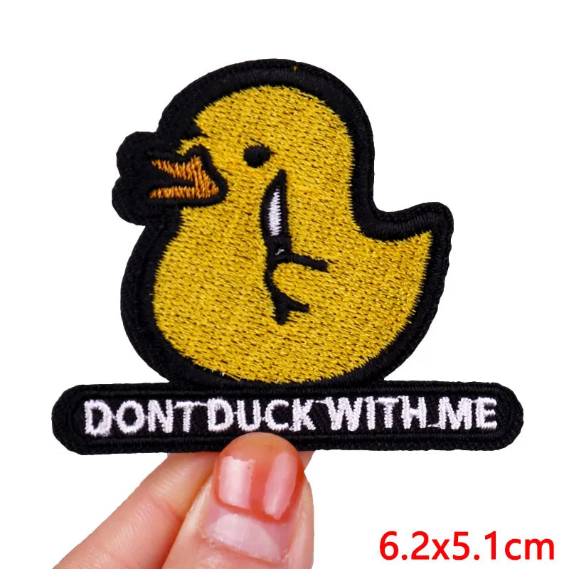 A yellow cartoon duck embroidered patch with a black outline and the text DON'T DUCK WITH ME