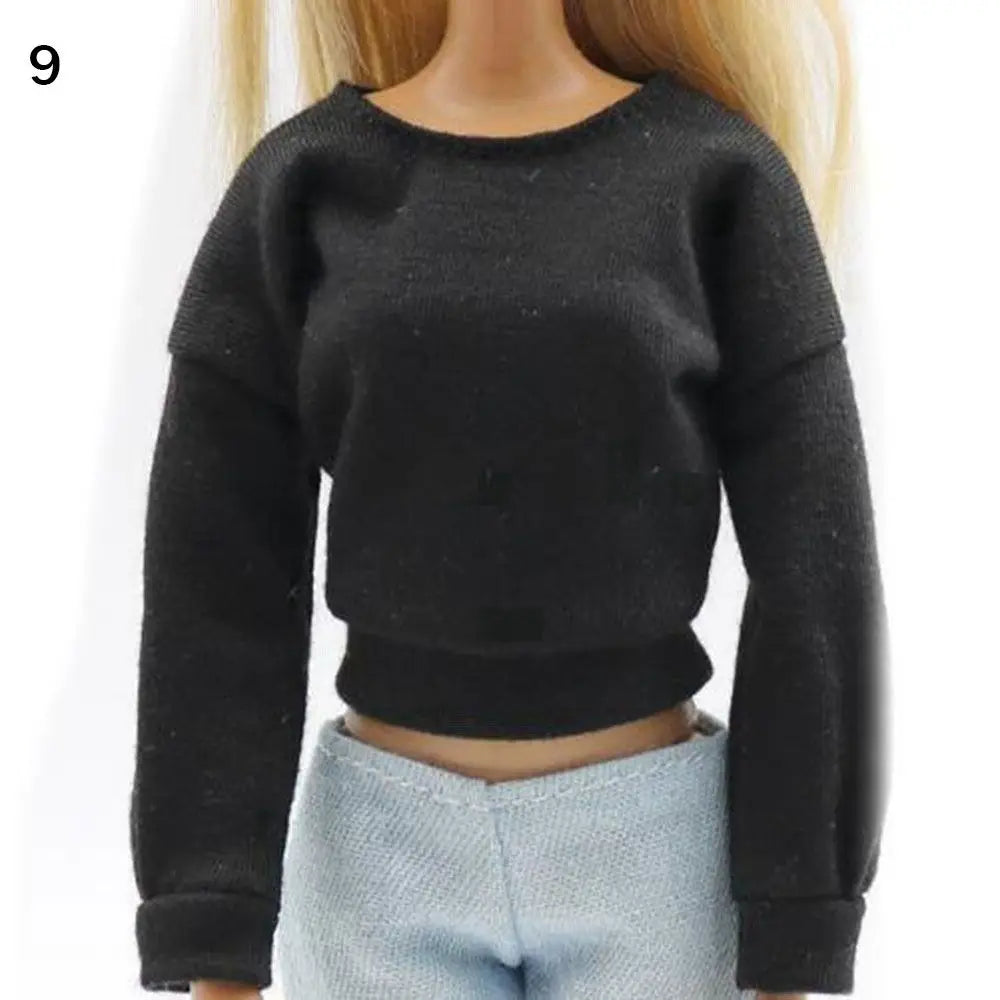 A black long-sleeved sweatshirt top for a fashion doll.