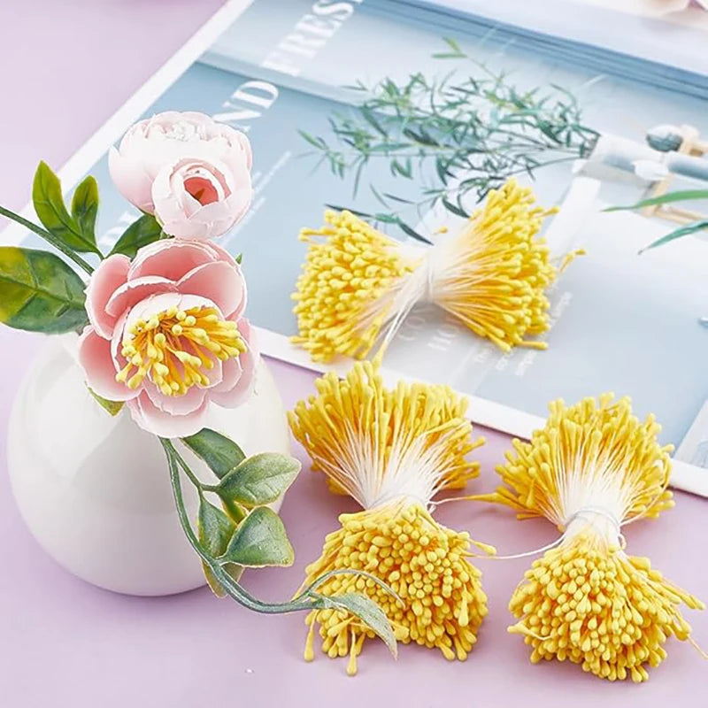 A collection of 400 pearl flower stamens in shades of pink and yellow for DIY crafts and wedding decor.