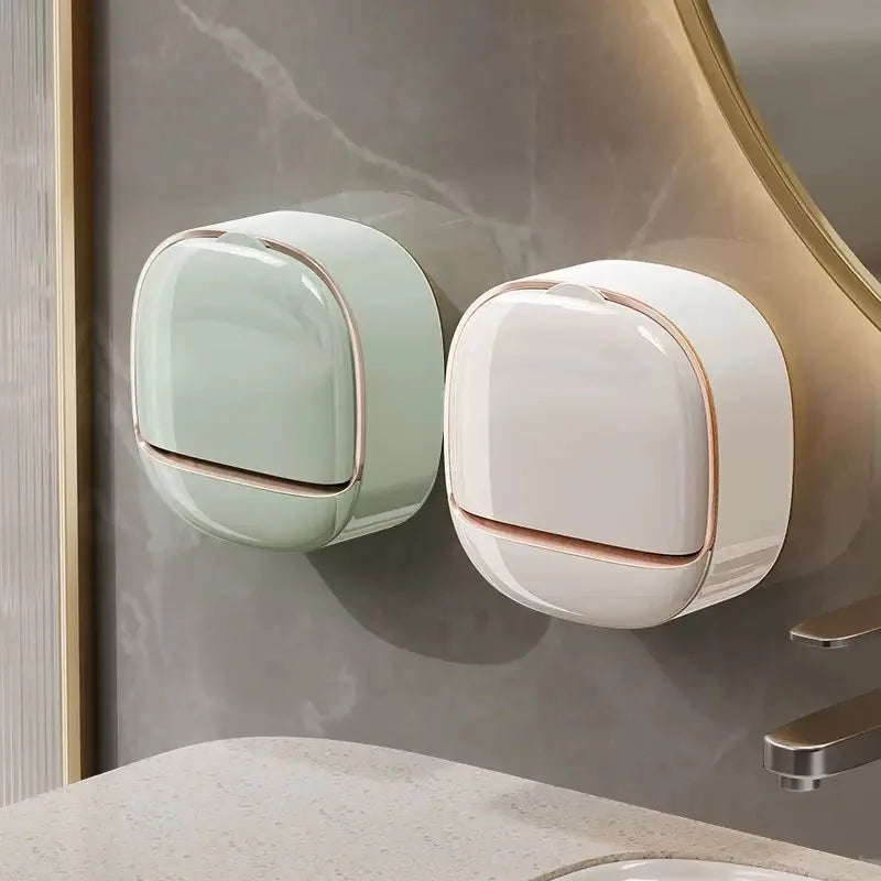A pair of modern, round, waterproof soap holders in mint green and white are mounted on a wall.