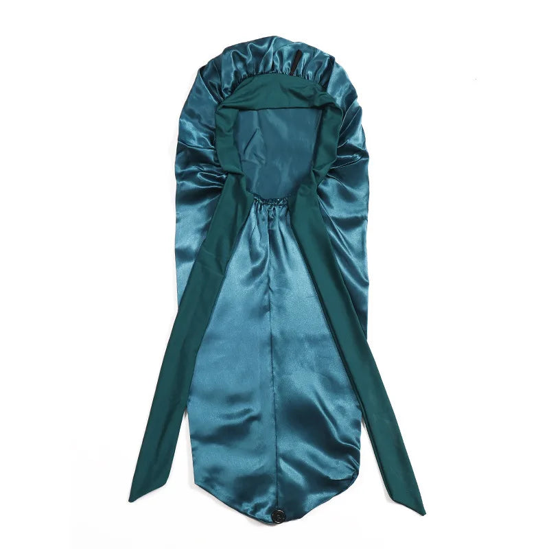 A teal satin sleep bonnet designed for long hair, braids, and dreadlocks.
