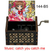 A wooden music box featuring a Cardcaptor Sakura character, with the title Catch You Catch Me visible.