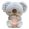 A white koala plush toy with closed eyes, featuring a soothing light on its chest.