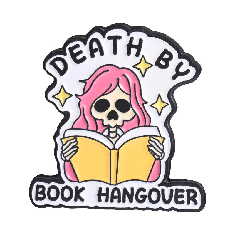 Enamel pin featuring a skull with pink hair and the text Death By Book Hangover