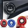 A close-up of a red and black rotary switch used as a rotating protective cover for a car ignition start button.
