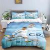 A blue duvet cover featuring a soccer player in white uniform flying over water, designed for kids and teens.