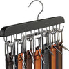 A black wooden belt organizer rack with fourteen metal hooks is displayed.