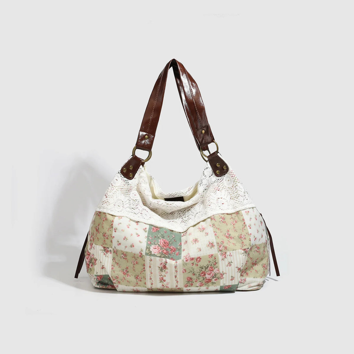 Sac à main patchwork floral beige et rose avec brides en cuir marron.