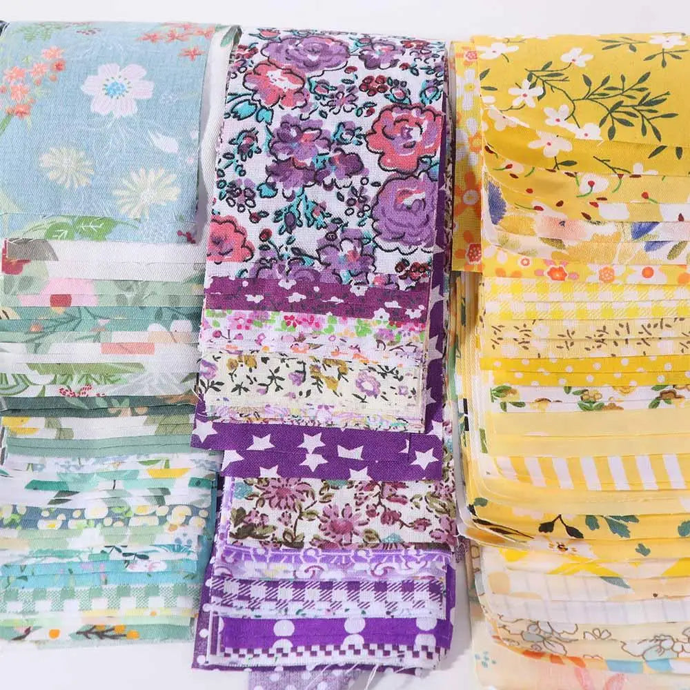 A collection of 40 floral cotton fabric strips in various colors and patterns for quilting and patchwork projects.