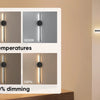 A display showing three color temperatures and dimming levels of rechargeable LED wall sconces.