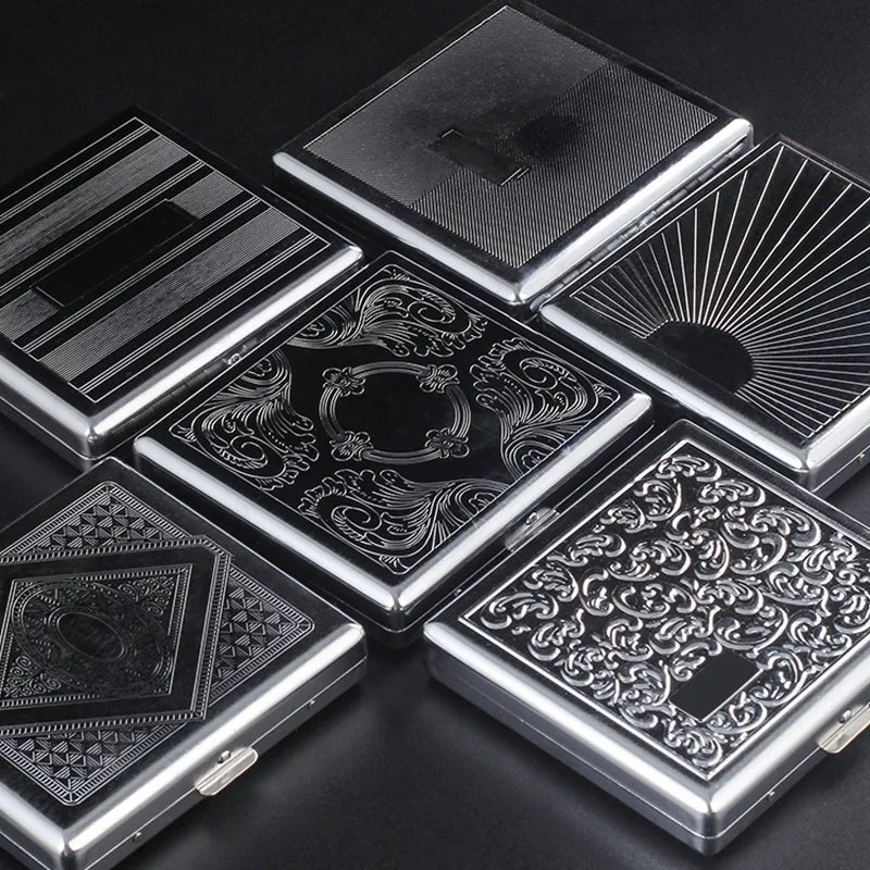 A collection of classic stainless steel cigarette cases with various embossed patterns and designs.