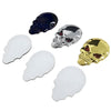 Three skull emblems in chrome, silver, and gold finishes displayed against a white background.