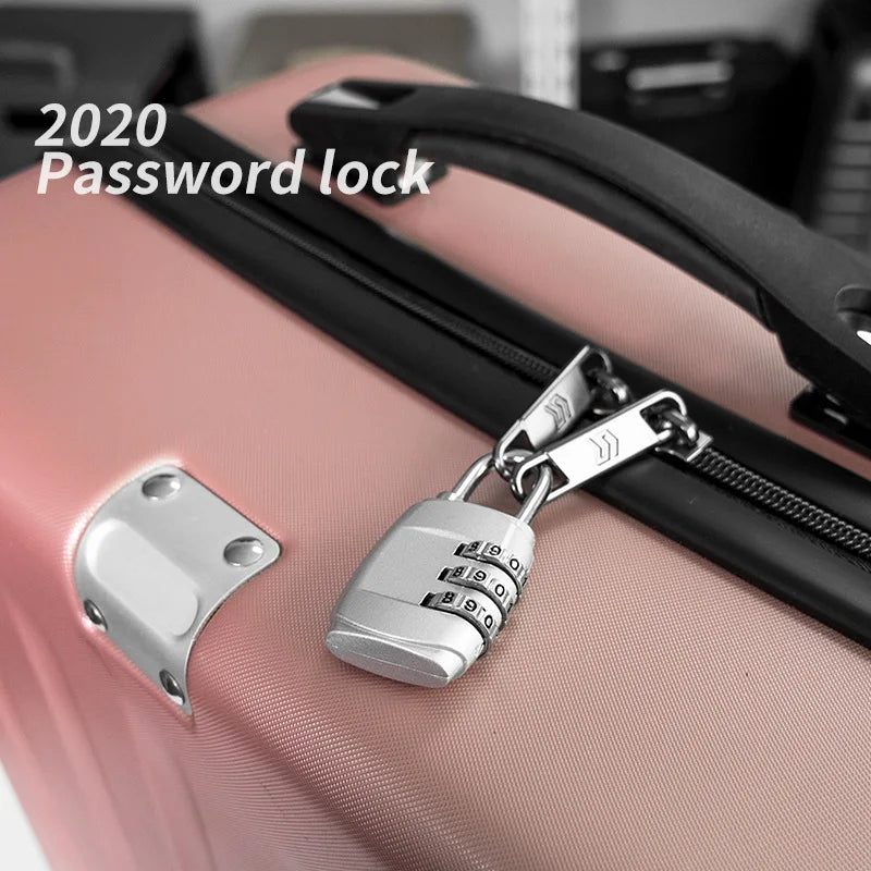 A silver multi-dial combination lock is attached to a pink suitcase, demonstrating a 2020 password lock feature.