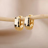 Boucles d'oreilles créoles en zircon cubique ton or