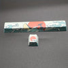 A set of coral sea themed PBT keycaps featuring waves, mountains, and a rising sun design.