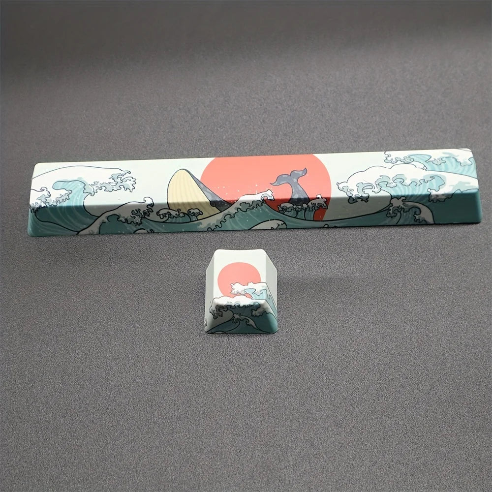 A set of coral sea themed PBT keycaps featuring waves, mountains, and a rising sun design.