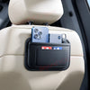 A black storage organizer bag with a clear window holds a smartphone and a small accessory, mounted on a light-colored car se