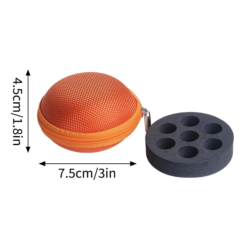 Orange spherical vial storage case with a black disc insert and a metal clip.