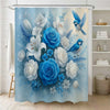 A light blue floral shower curtain featuring blue roses, white lilies, and blue birds.