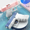 A pink and white high-capacity water blaster pistol is shown in a studio setting with blue water effects.