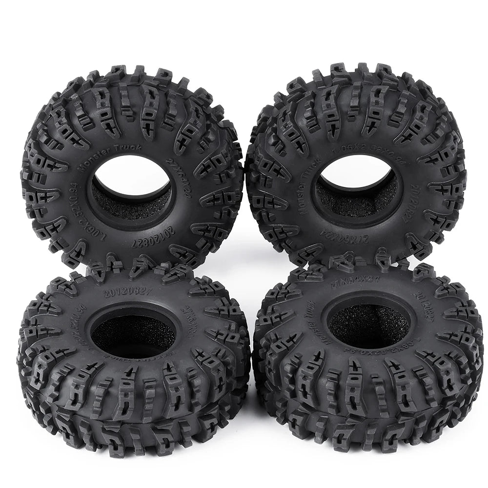 A pair of black mud terrain wheels and tires for RC crawlers.