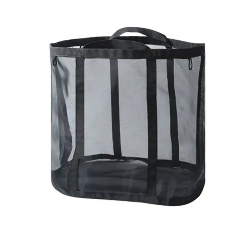 A black foldable mesh laundry basket with a handle.