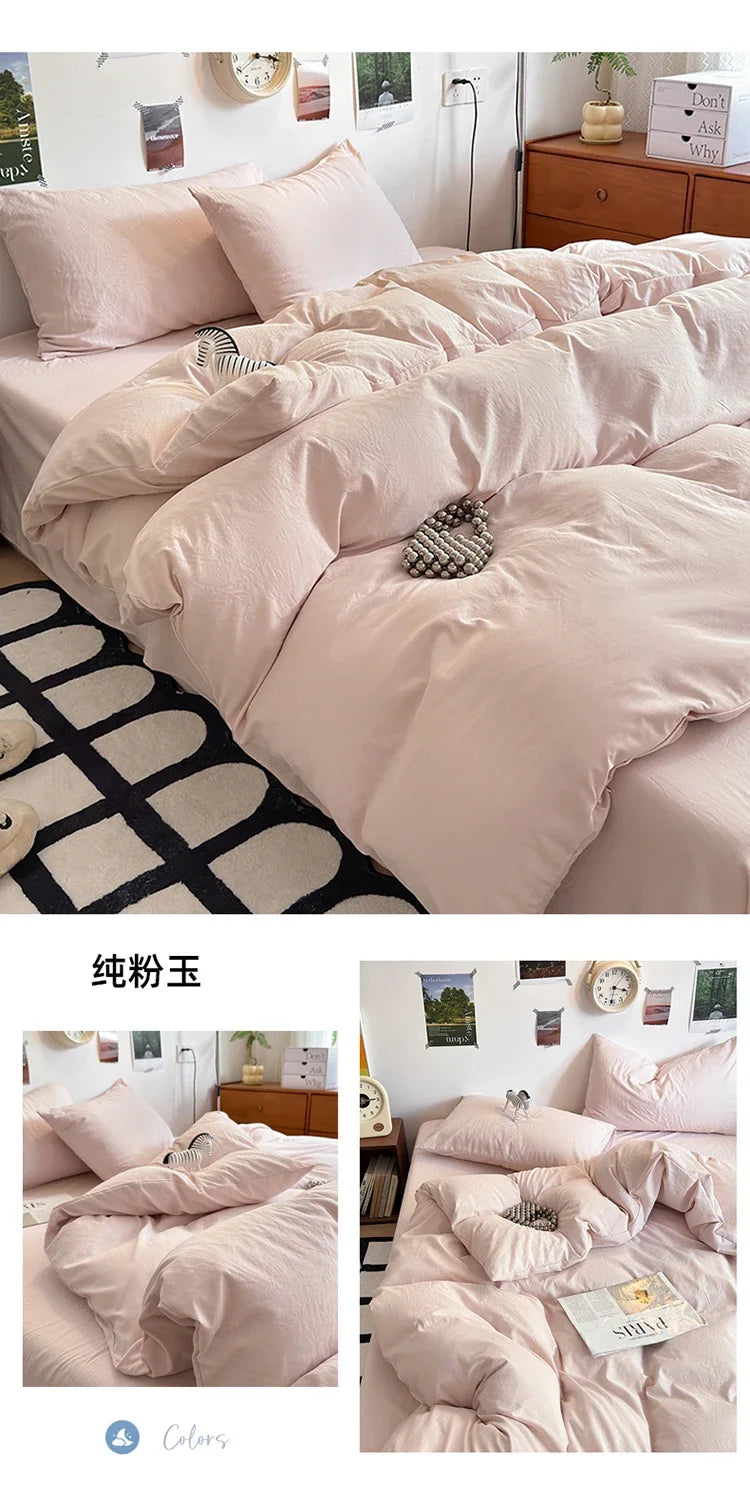 A set of four ultra-soft washed cotton duvet covers in a pale pink color displayed on a bed.