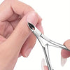 A hand is holding professional stainless steel manicure tools, including a cuticle trimmer and pusher.