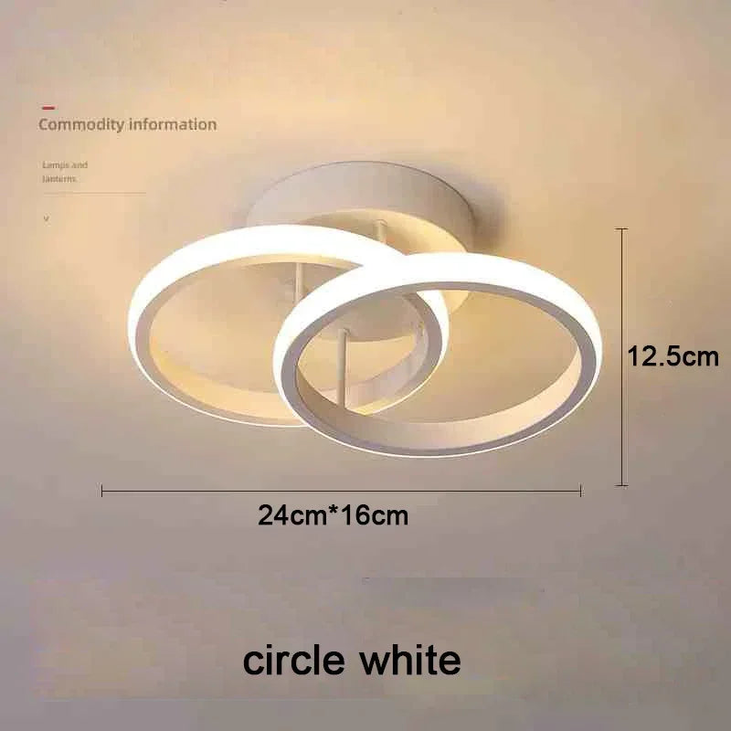 A white modern LED ceiling light fixture with a circular design shown against a light background.