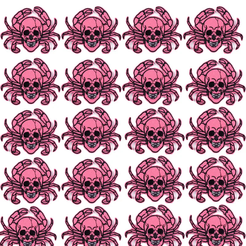 A set of ten embroidered iron-on patches featuring pink skulls and horror designs.