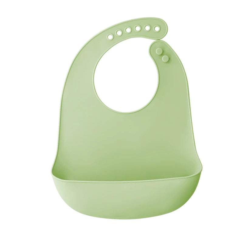 A light green silicone baby bib with a catch pocket for feeding