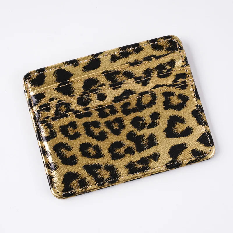 A brown leopard print PU leather card wallet shown from above.