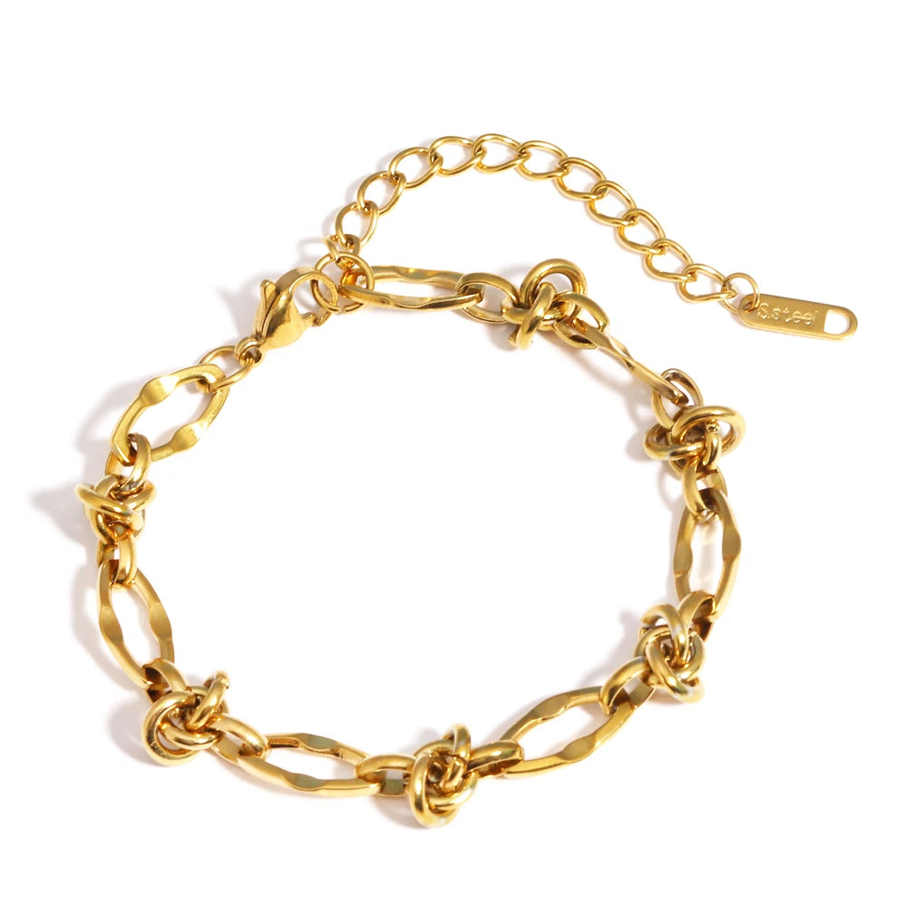 A gold-plated stainless steel link bracelet with a chain design.