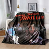 A black and red graphic print featuring Michael Jackson's thriller title on a flannel throw blanket.