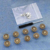 A silver instant no-sew snap button kit is shown on a translucent plastic bag with several buttons inside.