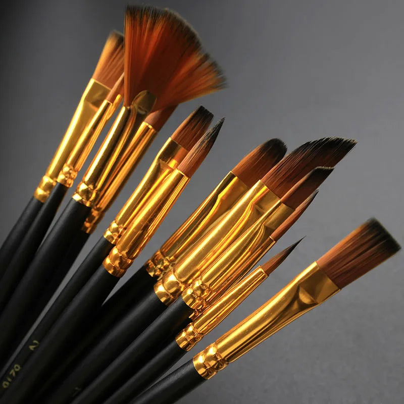 A collection of twelve black brush handles with golden ferrules and various sized nylon bristles for painting.